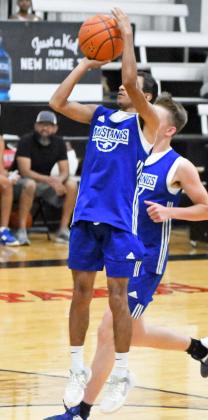 The Olton Mustangs competed at New Home last weekend in a summer basketball tournament. Shown is AJ Reyna pulling up for a midrange jumper, as the Mustangs took down Smyer in their opener, 6015. (Staff Photo by Derek Lopez)