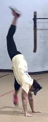 MRS KLOIBER -- doing a cartwheel for her winning class. (Submitted Photo)