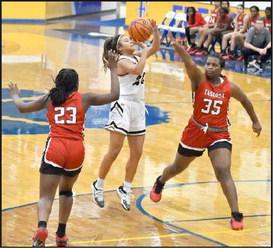 PULLING UP - Sudan’s, Edette Hererra (23), pulls up between two Tascosa defenders for a jumper from the elbow, during the second half of the Nettes’, 66-40, loss to the Tascosa Lady Rebels on Thursday afternoon in their second game of pool play at the Hub City Tip Off Classic at Frenship High School. (Staff Photo by Derek Lopez)