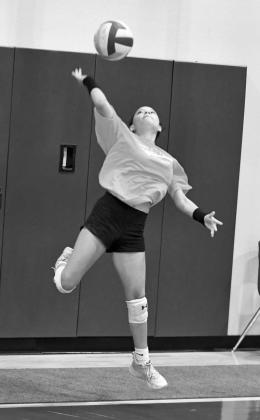 The Littlefield’s Faith Balderas sends a serve during a scrimmage, during the Lady Cat’s Midnight Madness practice to open two-a-days Monday morning. (Staff Photos by Derek Lopez)