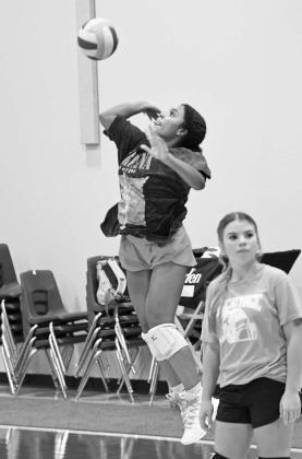 Littlefield’s Nia Cleveland works on her serve, during the Lady Cat’s Midnight Madness practice to open two-a-days Monday morning. (Staff Photo by Derek Lopez)