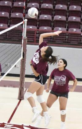 GOING FOR A KILL – Littlefield’s Julie Bownds goes up for a kill at the net, during the Littlefield Lady Cats’ first day of two-a-day practices on Monday at Wildcat Gym. (Staff Photo by Derek Lopez)