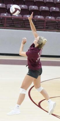 SENDING THE HIT – Littlefield junior, Madison McNeese, sends a hit over the net during team drills, during the Littlefield Lady Cats’ first day of two-a-day practices on Monday at Wildcat Gym. (Staff Photo by Derek Lopez)