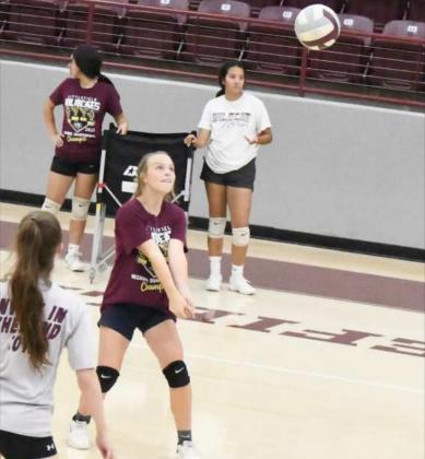 STOPING THE HIT – Littlefield junior, Kennadi Hanlin, stops a hit as their side looks to set up an attack, during the Littlefield Lady Cats’ first day of two-a-day practices on Monday at Wildcat Gym. (Staff Photo by Derek Lopez)