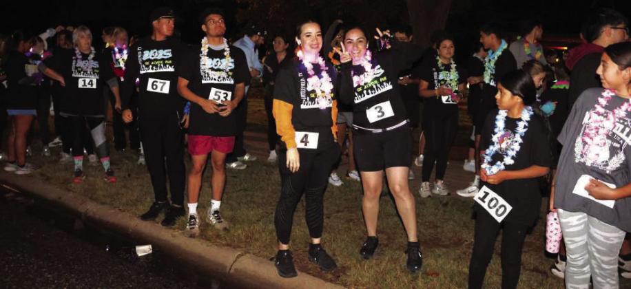 Humans and Zombies prepare for the first 5K Zombie run during the Pumpkin Trail Celebration held at Crescent Park in Littlefield, Texas on Saturday, October 25, 2025. (Photo by Ann Reagan)