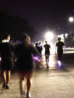 Runners in the first 5k Zombie Run start the competition marked route from Crescent Park to LHC Family Medicine and back under the supervision of LHC volunteers, and the Littlefield Police Department. (Photo by Ann Reagan)