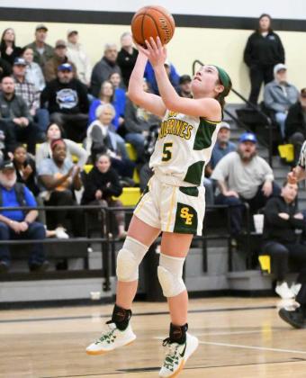 Springlake-Earth senior, Taytum Goodman, gets to the basket for a lay-up in transition, during the first half of the Lady Wolverines, 5540, Bi-district play-off loss to the Lady Mustangs on Tuesday at Bushland High School. (Staff Photo by Derek Lopez)