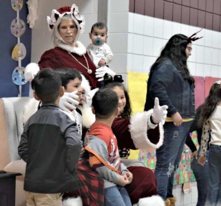 These youngsters are all smiles as they have a short visit with Santa at the Littlefield Primary Christmas Family Night Dec 13,2021. (Photo by Ann Reagan)