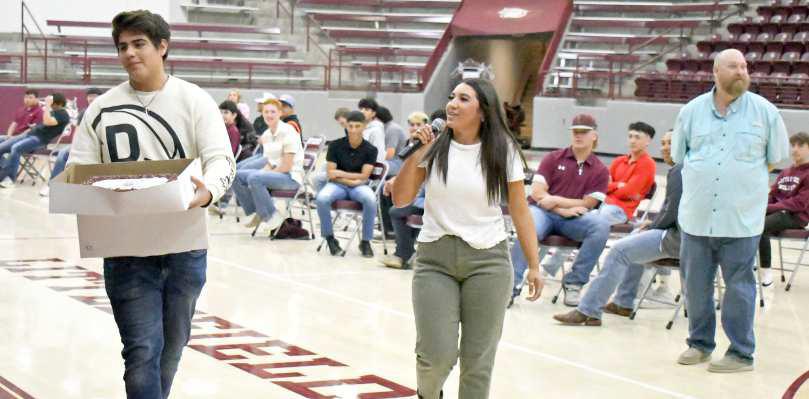 2023 CAKE AUCTION - Littlefield High School’s Student Council held their annual Cake Auction on Friday morning, with proceeds going towards Wildcat Wish. Shown is senior Alex Hernandez auctioning off Angel Hernandez’s cake. (Staff Photo by Derek Lopez)