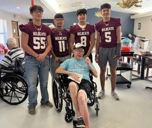 Littlefield High School senior football players, Uriel Ibarra, Zane Champion, Ben Castillo and Nate Castaneda pose for a picture wtih Mr. Warren Dayton. (Submitted Photo)