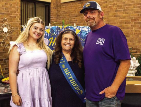 Retiree Candace, 'Candy,' Dalton celebrates retirement alongside her son and granddaughter, Mikey and Alexaundrea Dalton, at the Lamb County Healthcare atrium on May 26, 2026. (Photo by Madison Vidales)