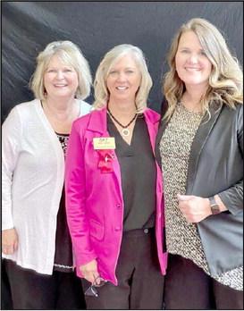 CELEBRATING SEVEN YEARS -- Donna Smith, Georgann Storm Board President Shelby's Bridge, and Shelby Lippold. (Photo by Ann Reagan)