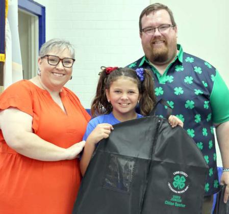 Brandon Albus and Kathy Lostroh presented Chloe Senter the junior Outstanding Record Book award at the 4-H Banquet held August 16, 2025 in Olton, Texas. (Photo by Ann Reagan)
