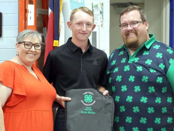 Brandon Albus and Kathy Lostroh presented Ryan Muller with the Senior Outstanding Record Book at the 4-H Awards Banquet held August 16, 2025 in Olton Texas. (Photo by Ann Reagan)