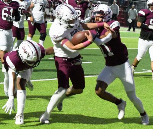 Littlefield senior running back, Ian Mendez, barrels through two would-be Roosevelt tacklers on his way to a 12-yard touchdown run to open the scoring in their contest against Roosevelt on Friday at Eagles Stadium. (Staff Photo by Derek Lopez)