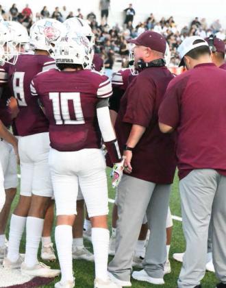 Shown is Littlefield Head Coach Jimmy Thomas talking with his team during a time out during their game against Muleshoe in the season-opener of the 2022 campaign. Coach Thomas passed away suddenly Monday morning, after being admitted into the Hospital Sunday evening. Coach Thomas spent the last two seasons at the helm of the Wildcat football program. His Family and friends are in our thoughts and prayers. (Staff Photo by Derek Lopez)