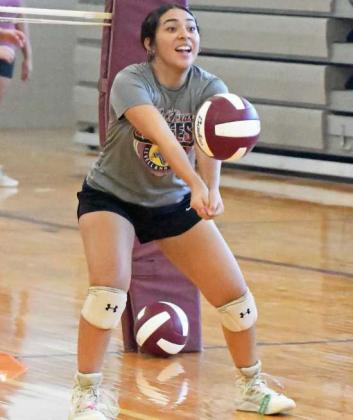 Littlefield Lady Cat Taylin Gomez works on hitting and receiving the ball while backing up, during their first day of two-a-days on Monday. (Staff Photo by Derek Lopez)