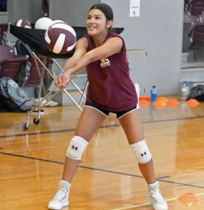 Littlefield Lady Cat Cali Saldana works on hitting and receiving the ball while backing up, during their first day of two-a-days on Monday. (Staff Photo by Derek Lopez)