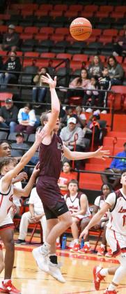 POINTS IN THE PAINT - Littlefield guard, Chip Green, puts up a floater in the lane, during the first half of the Wildcats’ double overtime loss on the road to the Lobos on Tuesday. (Staff Photo by Derek Lopez)