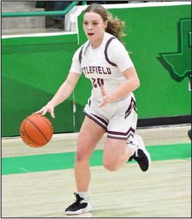 FAST BREAK - Littlefield junior, Kennadi Hanlin (20), brings the ball down court off of a steal, during the first half of the Lady Cats, Area round loss to Childress on Thursday in Floydada. (Staff Phtoo by Derek Lopez)