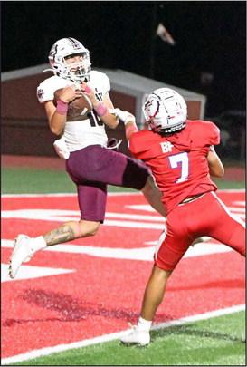 Littlefield’s, Ian Mendez (10), catches a 27-yard touchdown pass from Chip Green, during the fourth quarter of their, 71-70, loss to Coahoma on Friday on the road. (Staff Photo by Derek Lopez)