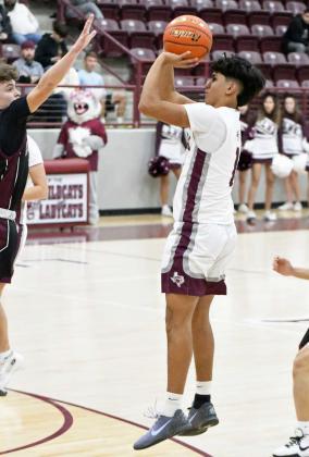 Littlefield’s Jayden Barrio pulls up for a jumper from the left elbow, during the first half of the Wildcats’ victory over Roosevelt at Wildcat Gym on Tuesday. (Staff Photo by Derek Lopez)