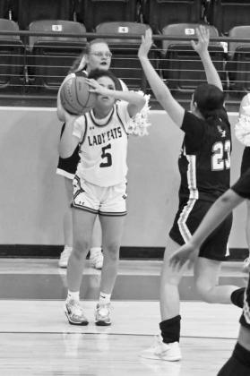 Littlefield’s Madison Williams (5), fires up a three from the right wing, during the Lady Cats’ victory over the Lady Mules last Tuesday. (Staff Photo by Derek Lopez)