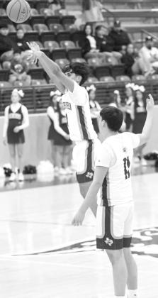 Littlefield’s Jayden Barrio (1), pulls up and drains a three from the logo to beat the buzzer last Tuesday, as the Wildcats took down the Mules in district play. (Staff Photo by Derek Lopez)