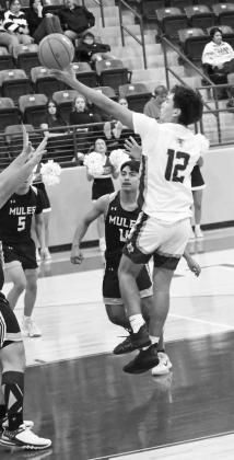 Littlefield’s Sammy Saenz (12), gets into the paint for a lay-up, during last Tuesdays tilt with Muleshoe at Wildcat Gym. (Staff Photo by Derek Lopez)