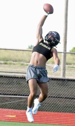 PUTTING IN WORK - The Sudan Hornets were hard at work Tuesday morning during their second day of two-adays. Shown is Salvador Juarez making a one-handed grab during team offense. The season opens on August 25th, at home against Olton at 7 p.m. (Staff Photo by Derek Lopez)