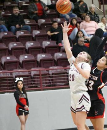 Littlefield senior, Kennadi Hanlin (20), goes up for a contested layup, during the first half of their victory over the Lady Cubs on Tuesday night. (Staff Photo by Derek Lopez)