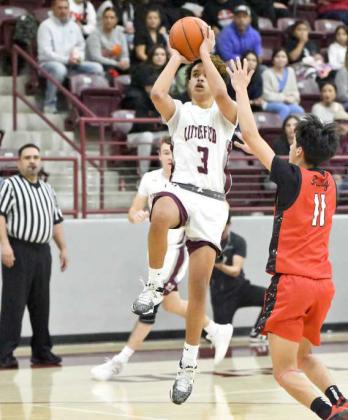 Littlfield junior guard, Ryan Williams (3), puts up a floater from the right elbow over Brownfield’s KJ Carroll (11), during the first half of the Wildcats’, 77-65, victory over the Cubs at Wildcat Gym on Tuesday. (Staff Photo by Derek Lopez)
