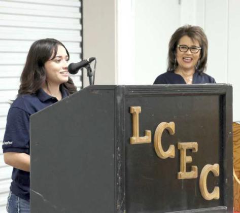 Naomi Mosqueda, the winner of the Youth Tour to Washington D.C., presented a brief overview of her experience in the nation’s capital as Lupe Marquez, Administrative Coordinator for LCEC, looks on. (Photo by Ann Reagan)