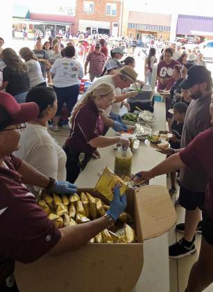 Hamburger meals were served at the 21st annual Wildcat Street Party on Friday. (Staff Photo by Derek Lopez)