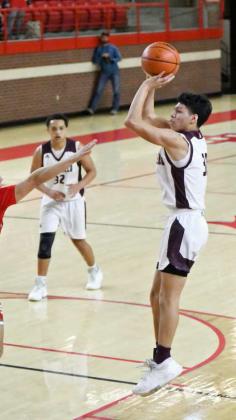 PULLING UP- Littlefield junior, Jeremiah Trevino (30), pulls up for a jumper from the left side, during the first half of the Wildcats, 4530, victory over the Buffaloes in Denver City on Monday night to claim the 3A Bi-district trophy. (Staff Photo by Derek Lopez)