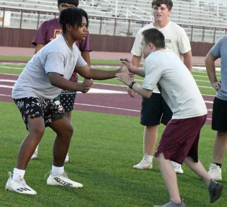 The linemen worked on sheding blocks and getting into the backfield, during the second night of park practice at Wildcat Stadium on Tuesday. (Staff Photo by Derek Lopez)