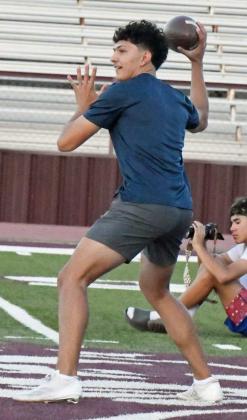 Quarterback Nate Castaneda fires a pass to an open receiver during the second night of park practice at Wildcat Stadium on Tuesday. (Staff Photo by Derek Lopez)
