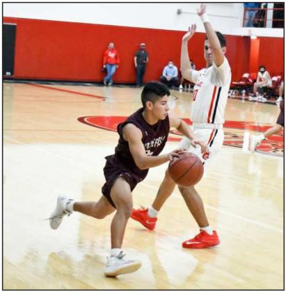 LOOKING TO DRIVE — Littlefield senior guard, Joseph Salinas (24), gets by the Brownfield defender, during the Wildcats’ victory over the Cubs in their first meeting on the road on Friday at the Pit. (Staff Photo by Derek Lopez)