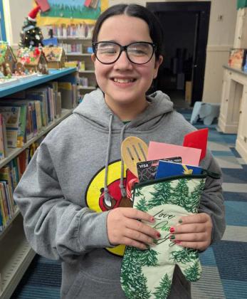 Arianna Sea took second place in the 9-12-year old age division of the Lamb County Libraries Gingerbread House Contest. (Submitted Photo)