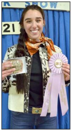 BEEF SHOWMANSHIPAddison Boehning, Sudan, received the award buckle for the beef heifer and steer divisions. (Staff Photo by Joella Lovvorn)