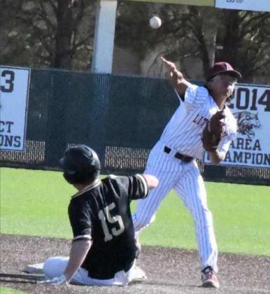 TRYING TO TURN TWO – Littlefield sophomore second baseman, Isaiah Rodriguez, catches a flip from Jordan Trevino (not pictured), and fires to first for the double-play try, during the top of the third inning of the Wildcats, 7-6, victory over the Falcons on Friday in extra innings. (Staff Photo by Derek Lopez)