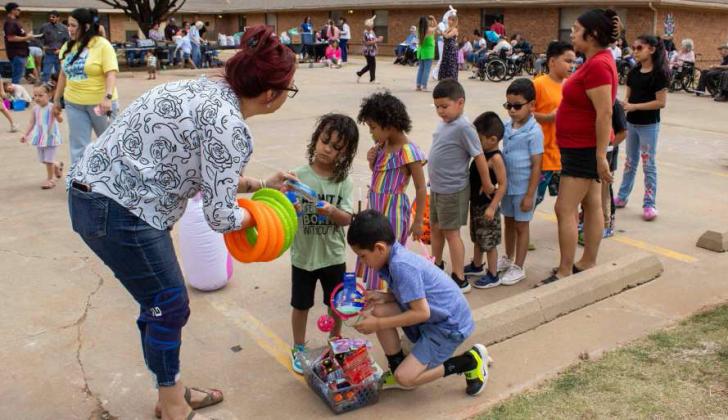 Attendees play a ring toss game at Sunset Valley Rehabilitation and Healthcare Center's Easter event on April 3, 2026. (Photo by Madison Vidales)