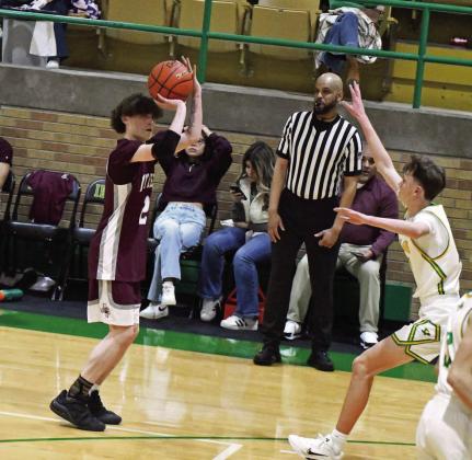 Littlefield’s Andrew Davis (2), fires up a three from the left elbow, during the second half of the Wildcats’ road victory over Idalou on Friday night. (Staff Photo by Derek Lopez)