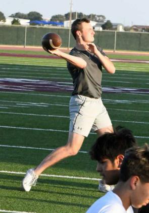 Quarterbacks and receivers worked on throwing/catching drills to open up the first day of Park Practice monday evening at Wildcat Stadium. (Staff Photo by Derek Lopez)