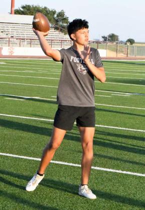 Quarterbacks and receivers worked on throwing/catching drills to open up the first day of Park Practice monday evening at Wildcat Stadium. (Staff Photo by Derek Lopez)