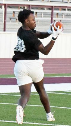 Eizeah Coleman catches an out route, during route running drills at Park Practice on Monday at Wildcat Stadium. (Staff Photo by Derek Lopez)