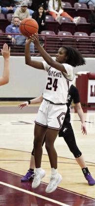Littlefield sophomore, Amoni Jefferson, knocks down a jumper in the lane, during the first half of the Lady Cats’ victory over Muleshoe Tuesday night at Wildcat Gym. (Staff Photo by Derek Lopez)