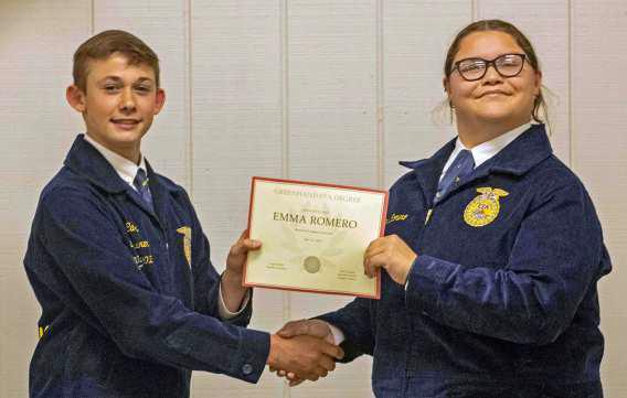 FFAVice President Ty Carr presents Emma Romero with a Greenhand FFA Degree at the annual FFA banquet on May 12, 2025. (Staff Photo by Madison Vidales)