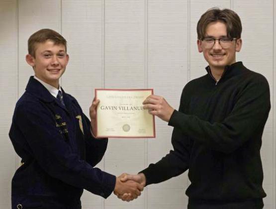 FFA Vice President Ty Carr presents Gavin Villanueva with a Greenhand FFA Degree at the annual FFA banquet on May 12, 2025. (Staff Photo by Madison Vidales)