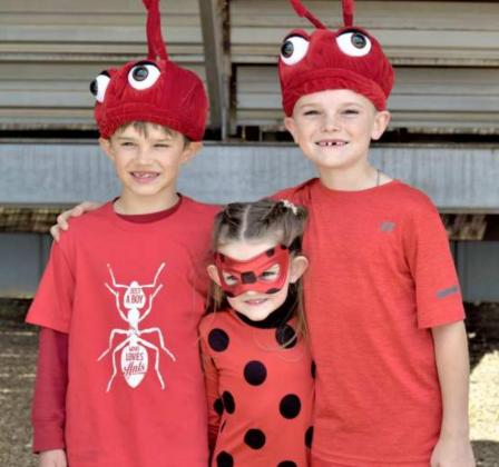 TWO RED ANTS AND A LADYBUG were discovered after the performance from left to right-Waverly Aduddell age 8, Emerson Yesel age 4, and Easton Yesel age 8. (Photo by Ann Reagan)